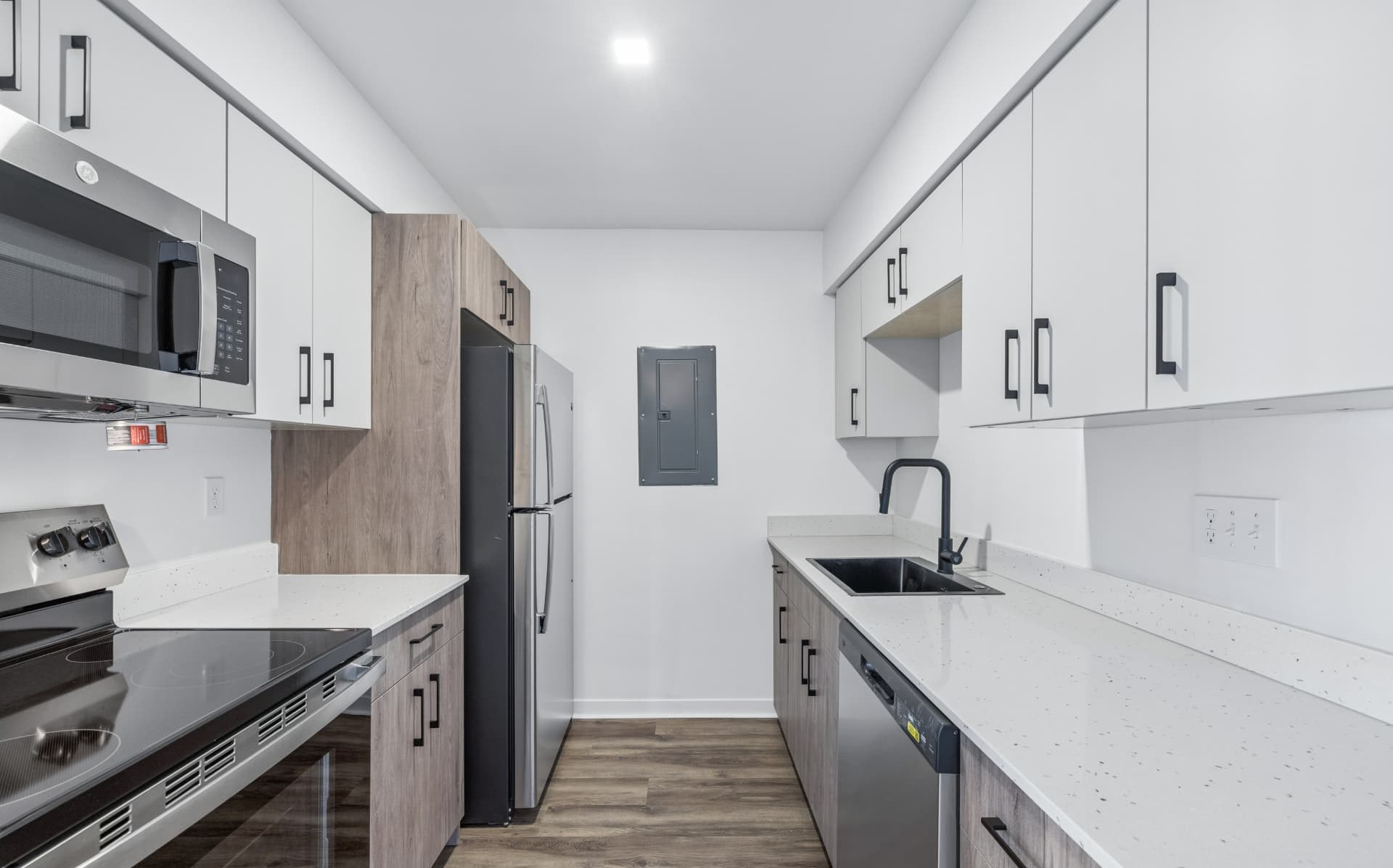 Galley kitchen with modern cabinetry and stainless appliances